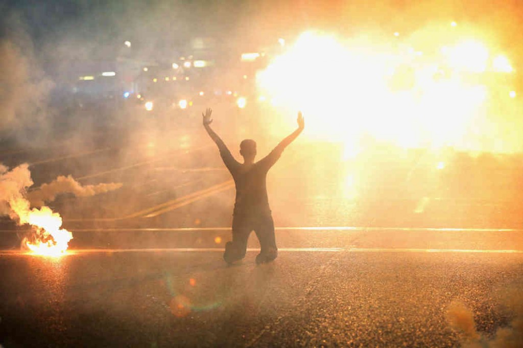 Ferguson Protestor Amid Flares