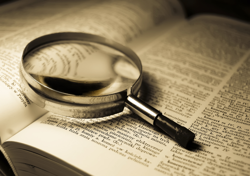 Magnifying Glass on Dictionary
