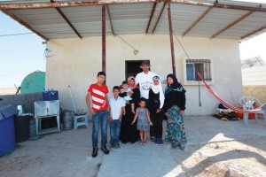 Abu-Quian Family in front of their home