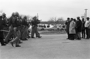 John Lewis, Hosea Williams, Robert Mants, and other marchers face a line of state troopers in Selma