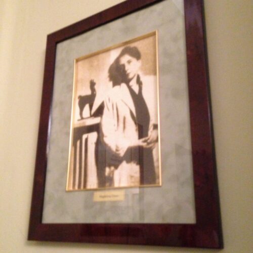 A photograph of Antonina Żabiński hangs on the wall.