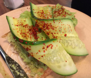 Counting the omer deliciously with this Avocado tartine with sliced cucumber, shredded iceberg lettuce, paprika, coarse salt.