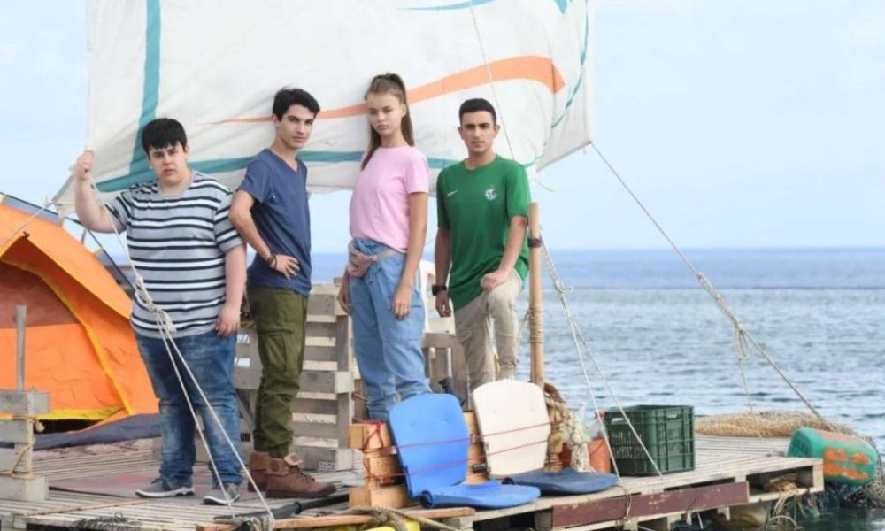 The Raft: four teenagers posed on raft