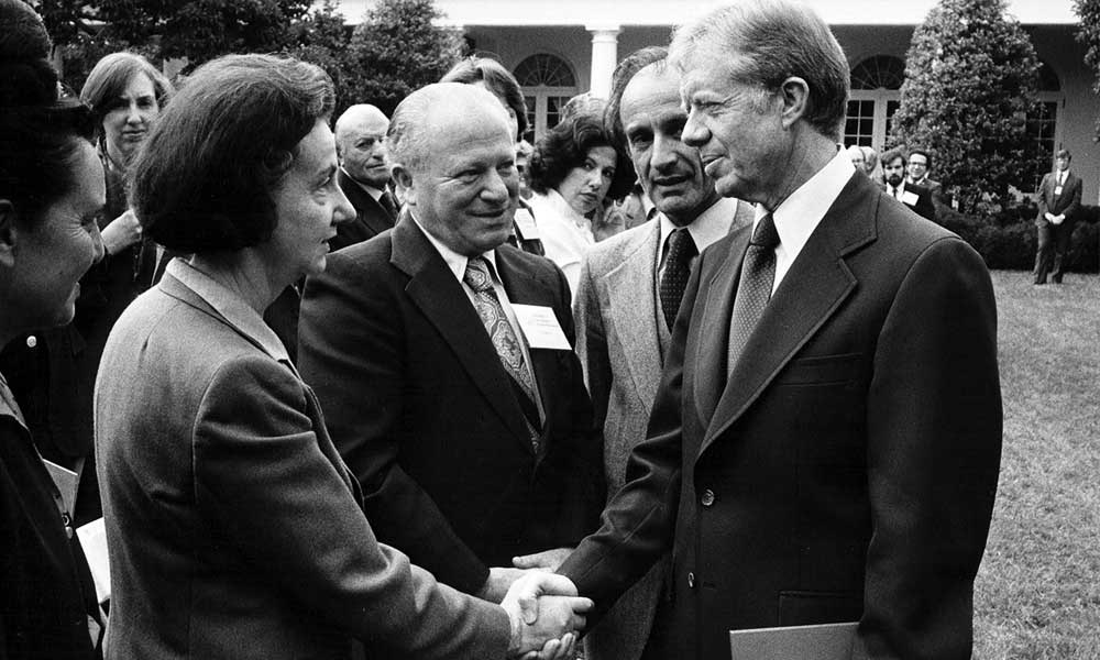 President Jimmy Carter shakes hands with Holocaust survivor Vladka Meed.