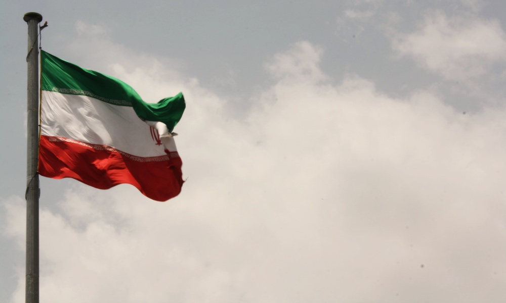 an Iranian flag blowing in the wind