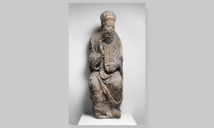 a stone sculpture of Moses holding the tablets