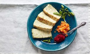 Sliced gefilte fish with horseradish and carrot
