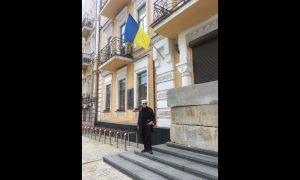 A Ukrainian flag hangs outside a building in Kyiv