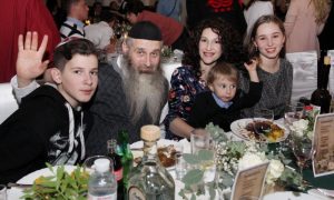 A Jewish family gathers together in celebration