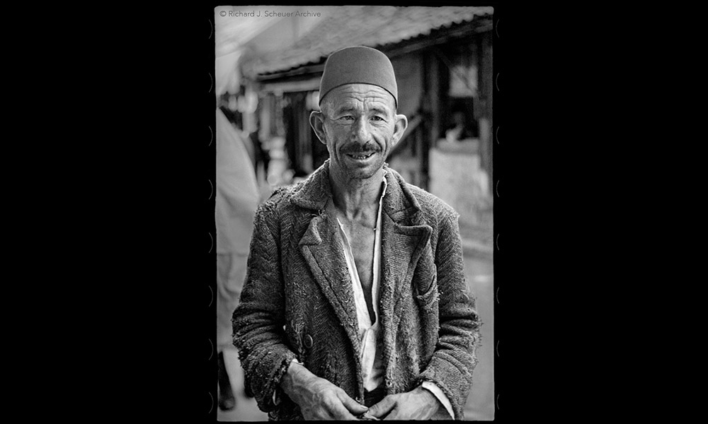 A photo of a man wearing a fez in Sarajevo