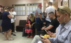 Citizens of Kyiv wait in a permit office