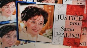 A red, white and blue sign with a picture of Sarah Halimi that reads "JUSTICE pour Sarah Halimi"