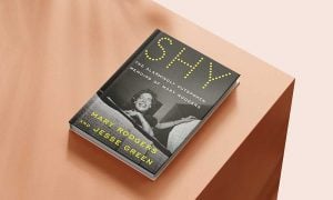 Shy, by Mary Rodgers and Jesse Green, sitting on a beige table