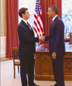 Ensler shakes hands with President Obama in the Oval Office.