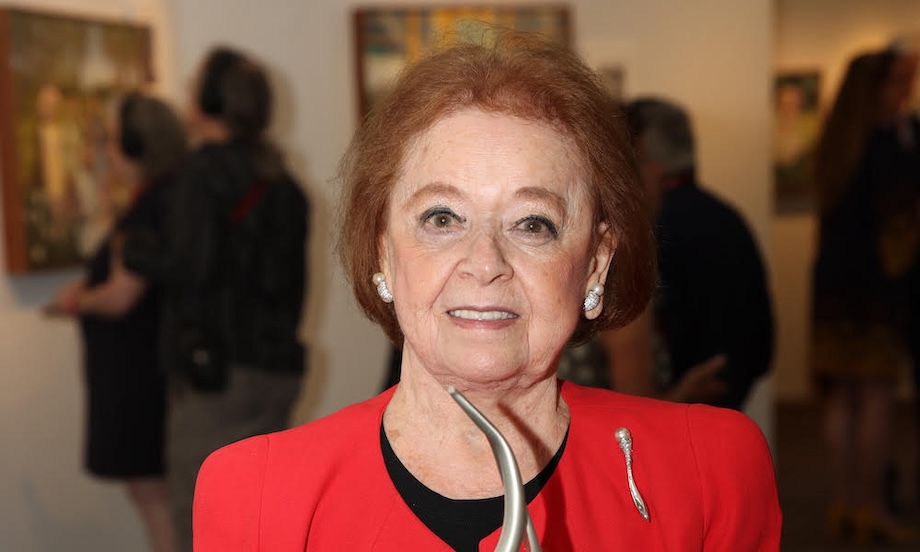 Lusia Milch smiling at an art gallery