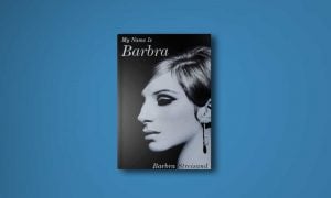 Barbra Streisand looking to her right, in a black and white photo. Only the left side of her face is visible
