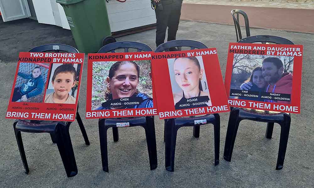 Chairs with pictures of hostages from the Goldstein placed on them
