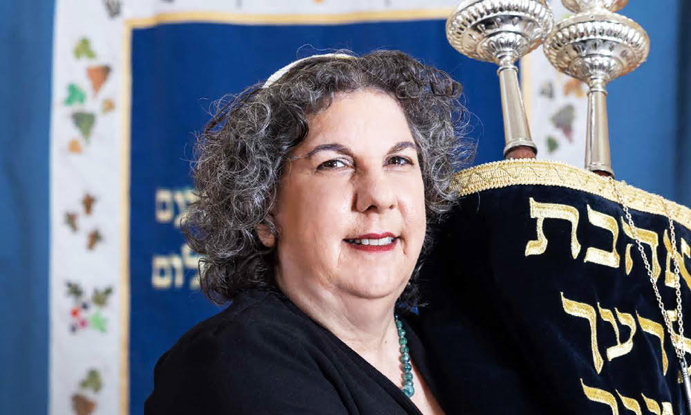 Rabbi Galia Sadan holding a Torah