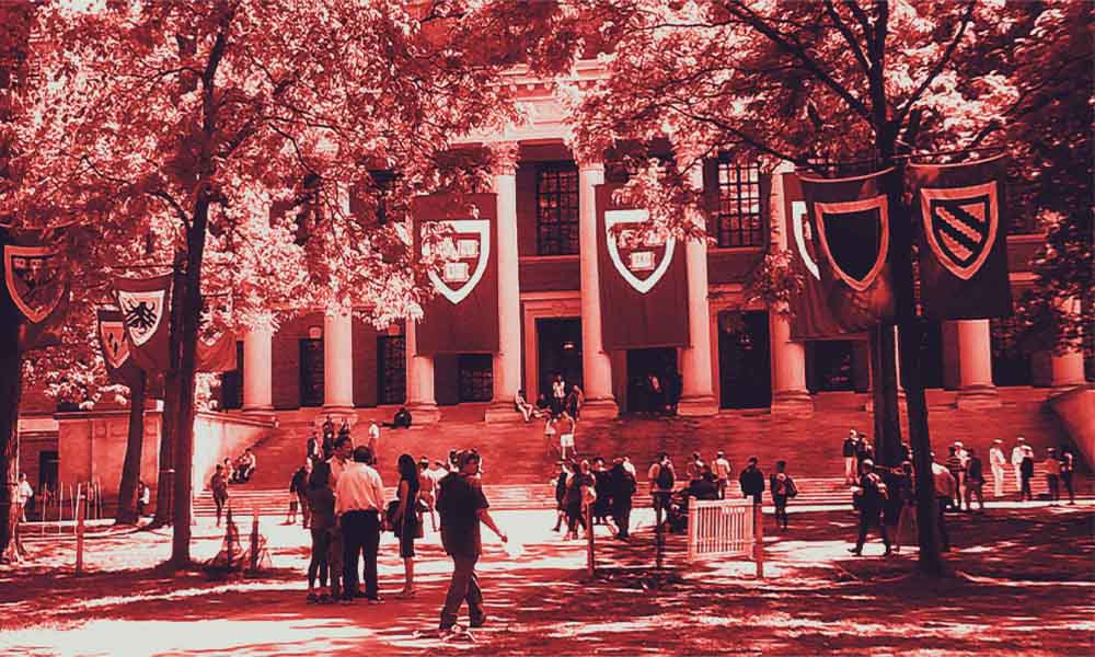 Red-washed photo of the Harvard college quad.