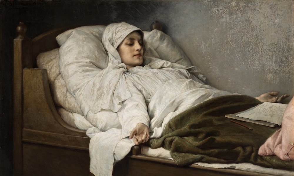 Woman draped in white night garments sleeps in a bed