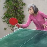 Eileen playing ping pong.