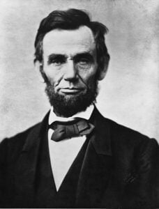 Black and white portrait photo of Abraham Lincoln.