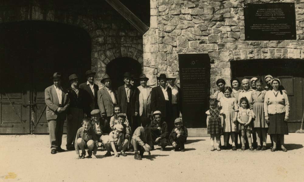 Orthodox Jewish Holocaust survivors and their children visit the Mauthausen concentration camp circa 1960.