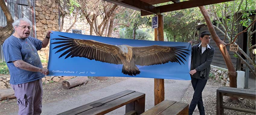 Yossi Leshem with photo of Griffon Vulture at JBO.