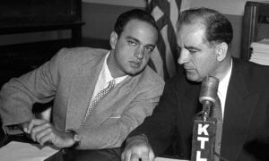 Senator Joseph McCarthy (right) confers with his HUAC chief counsel, Roy Cohn (left), in 1953.